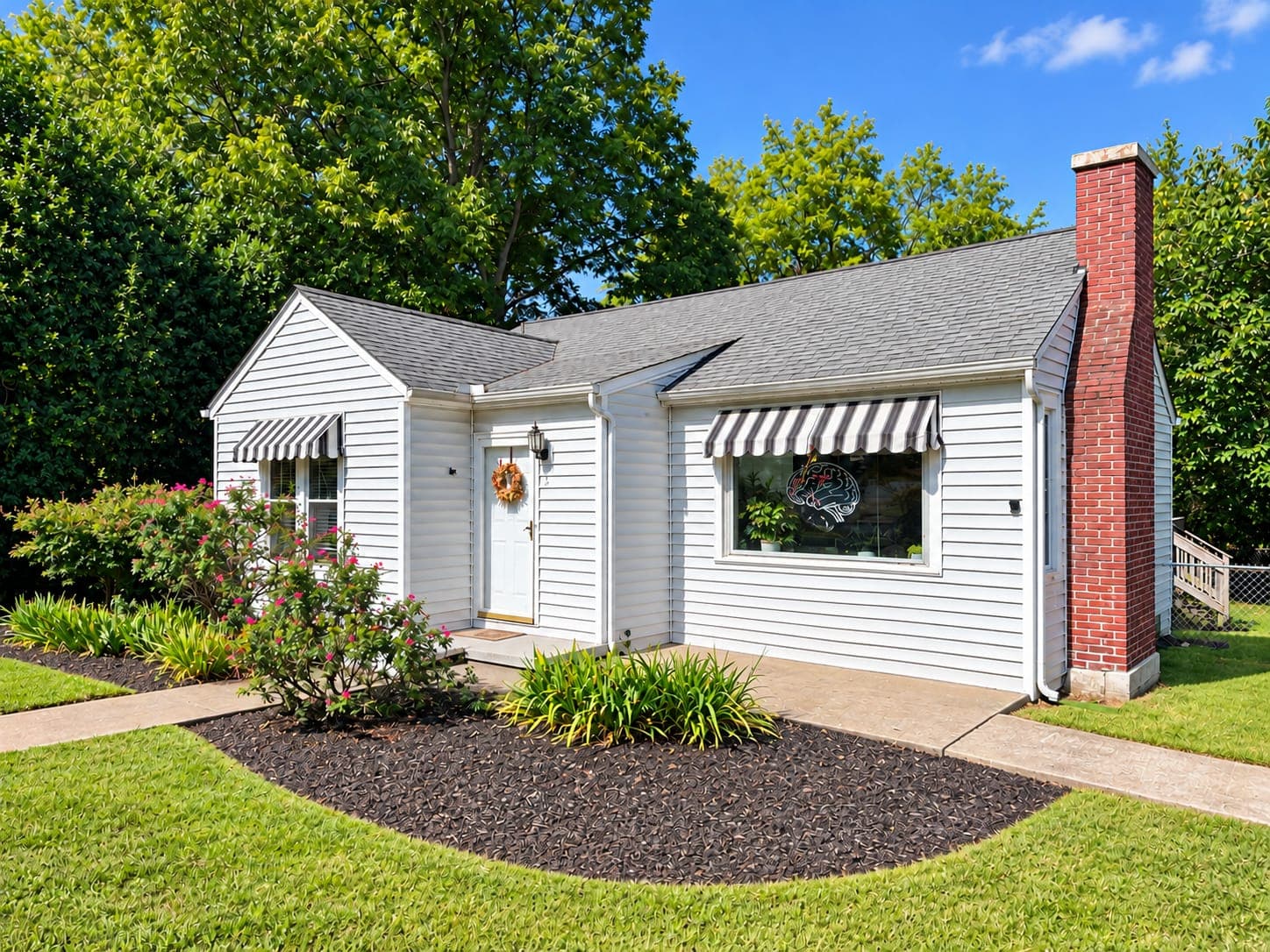 The Murfreesboro center seen from the street: a white cottage with striped awnings, the brain logo in the front window.