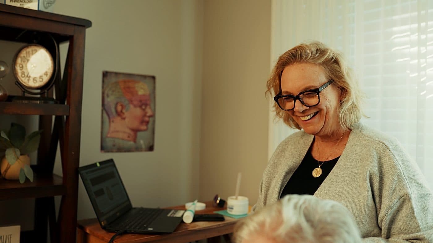 A structured check-in conversation at a Harmonized center